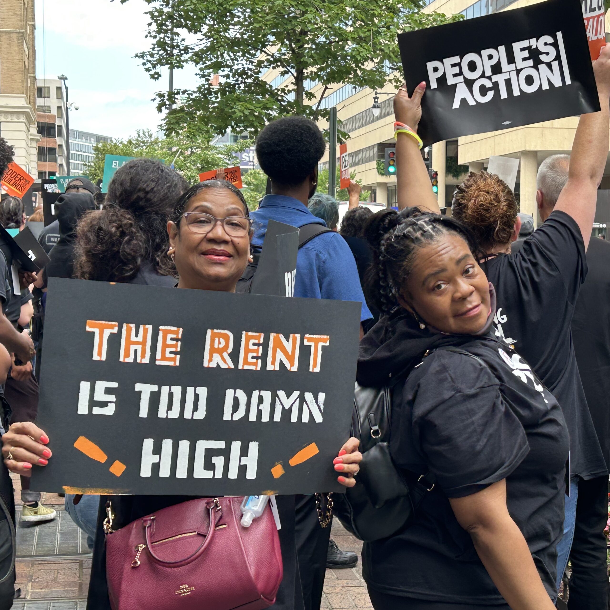 A photo of Down Home members, joined by People's Action, holding signs at a rally in Washington, D.C., advocating for affordable housing.